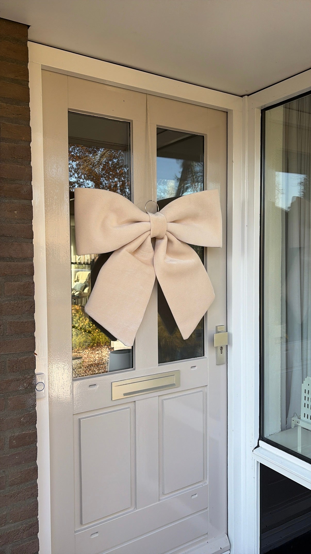 Strik beige voordeur